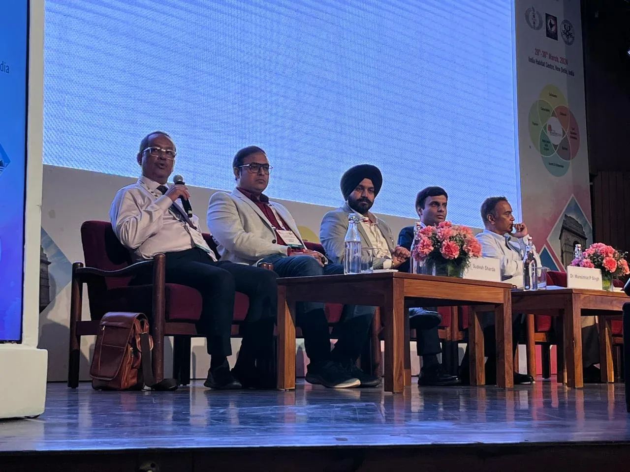 Dr. Mansimrat on a surgical conference panel